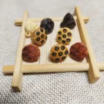 Boxwood Ebony Lotus Charm